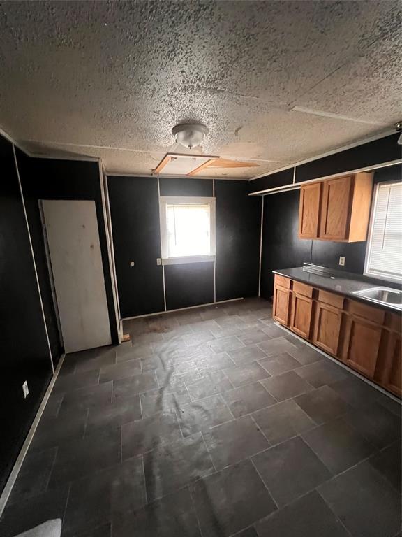 206 Third Street Hillsboro, TX 76645 - Photo 7 of 14 a view of an empty room with window and stairs