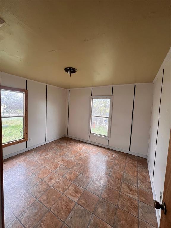 206 Third Street Hillsboro, TX 76645 - Photo 9 of 14 a view of an empty room and a window