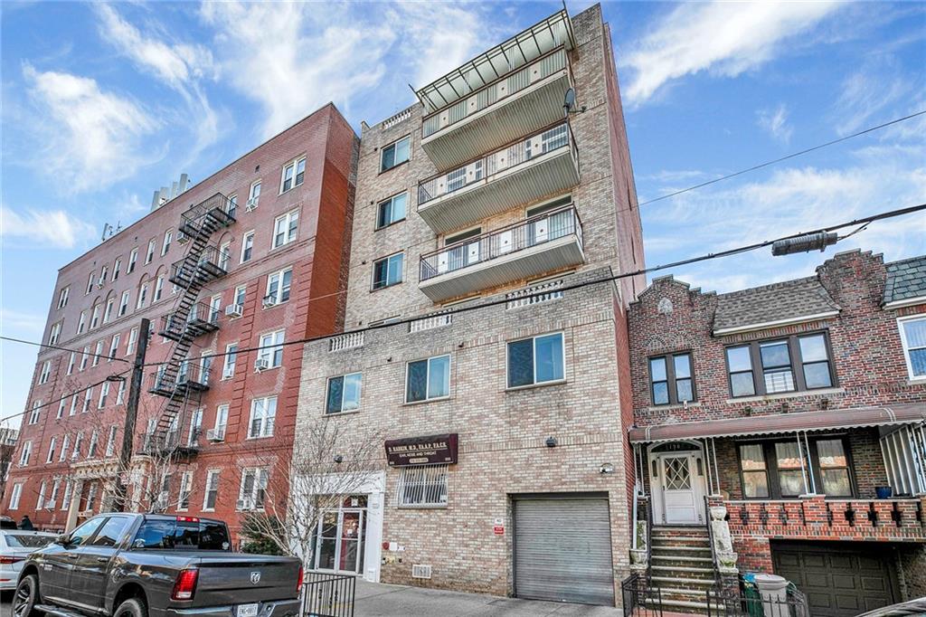 202 Quentin Road, Unit 2B Brooklyn, NY 11223 - Photo 15 of 16 a tall building sitting on the side of a street