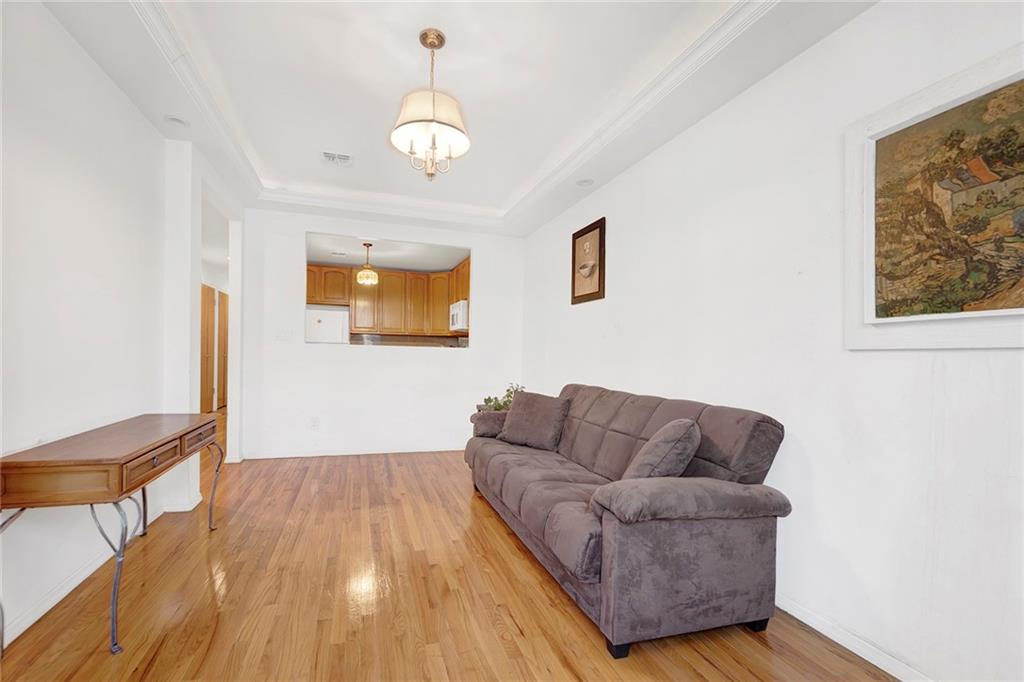 202 Quentin Road, Unit 2B Brooklyn, NY 11223 - Photo 3 of 16 a living room with furniture and a wooden floor