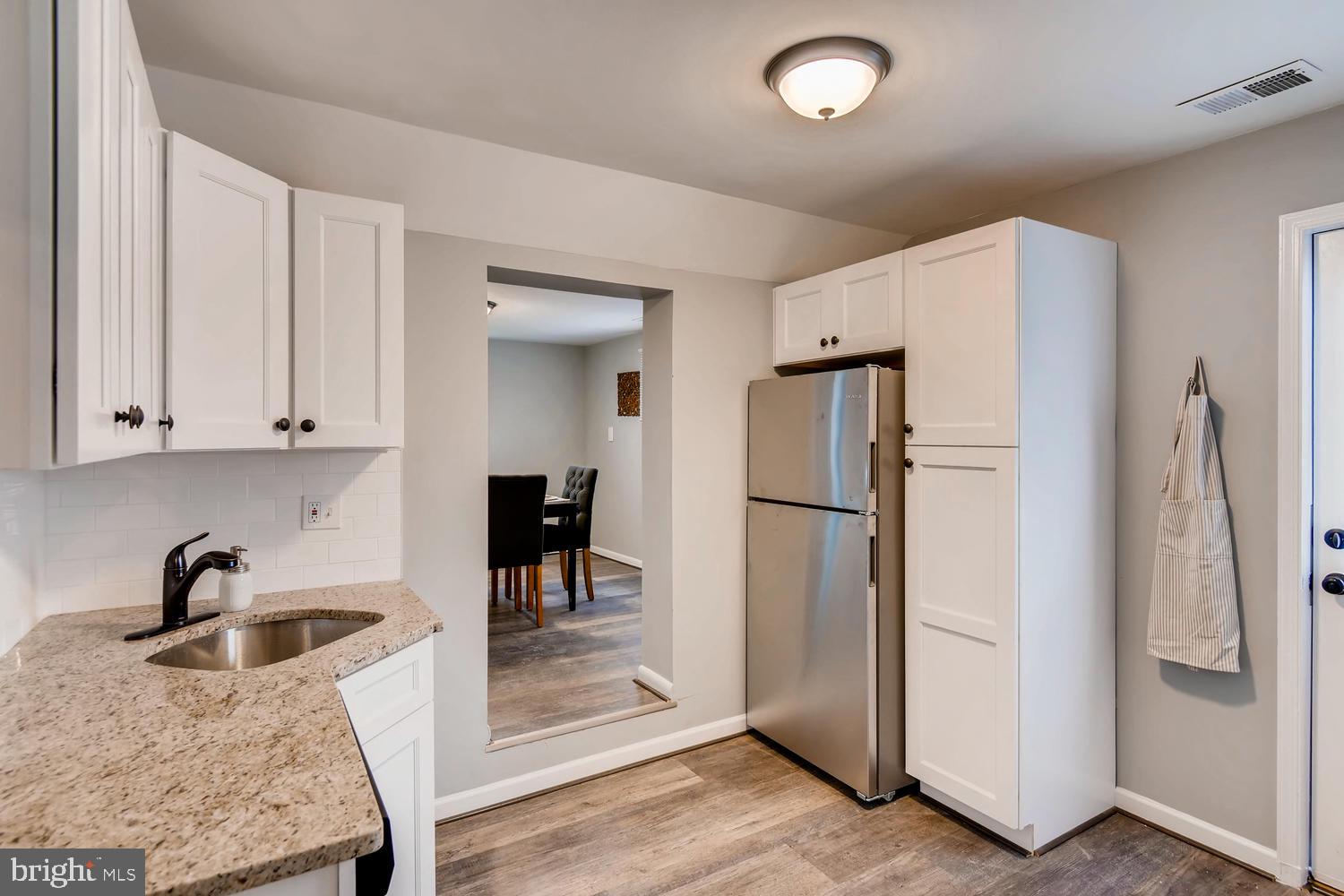 3501 Louth Road Baltimore, MD 21222 - Photo 2 of 27 a kitchen with stainless steel appliances granite countertop a refrigerator a sink and a stove
