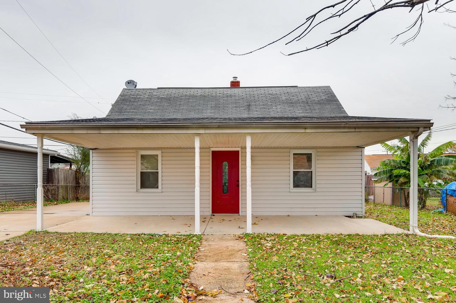 3501 Louth Road Baltimore, MD 21222 - Photo 22 of 27 a front view of a house with a yard