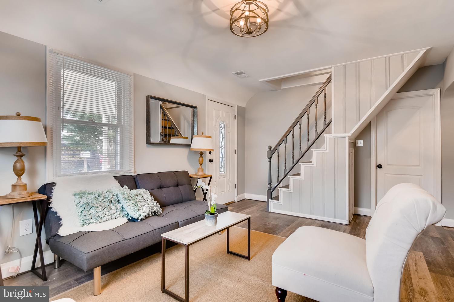 3501 Louth Road Baltimore, MD 21222 - Photo 6 of 27 a living room with furniture and a large window