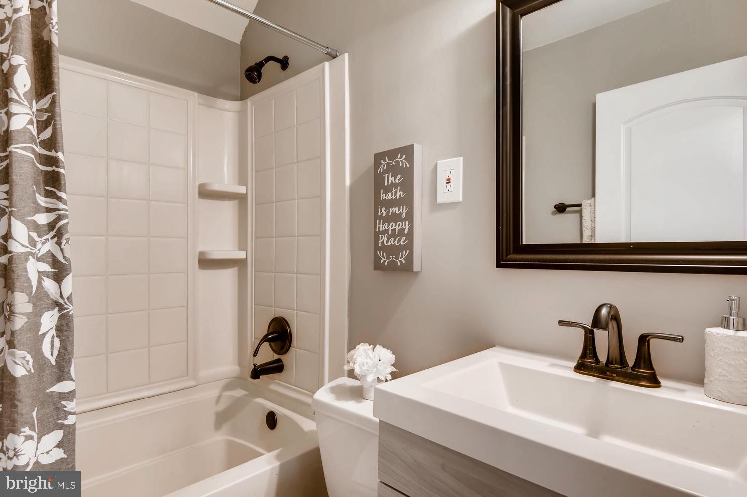 3501 Louth Road Baltimore, MD 21222 - Photo 8 of 27 a bathroom with a tub sink and mirror