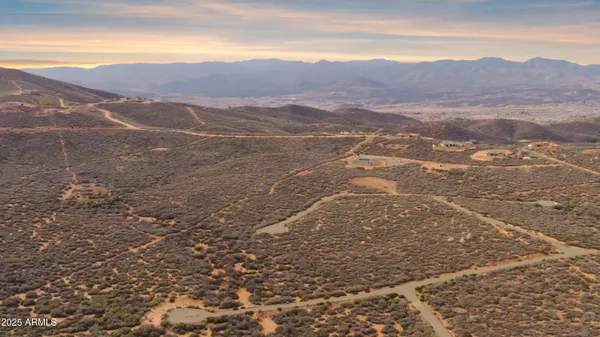 a view of an ocean and a mountain