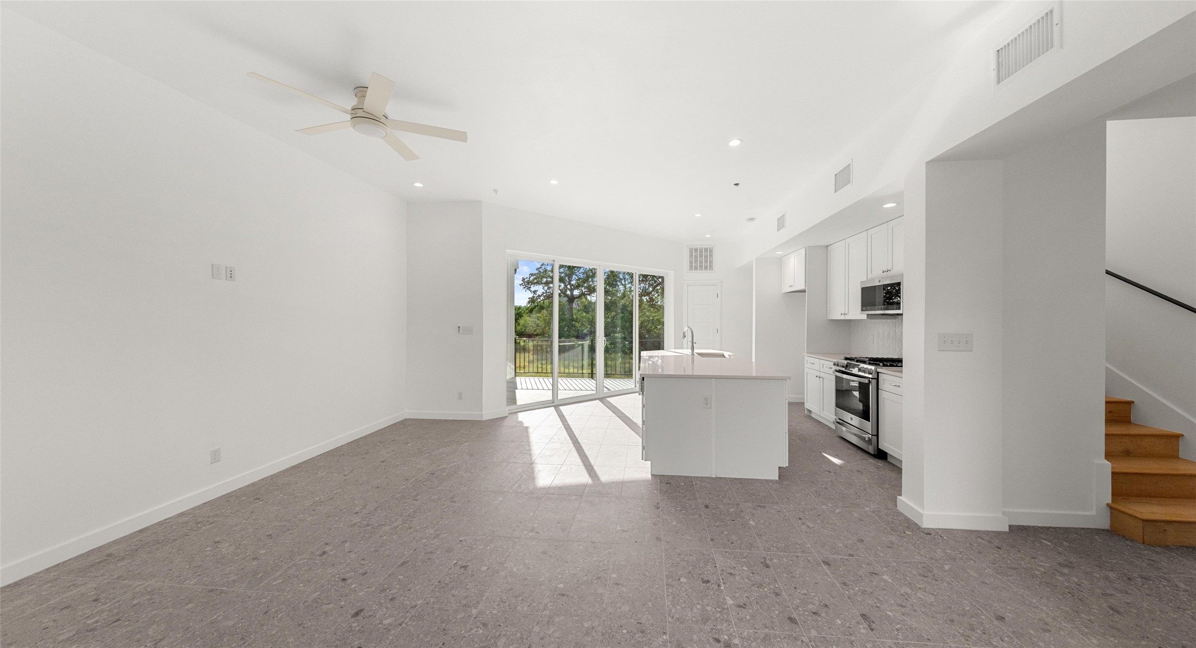 5912 Harold Court, Unit 106 Austin, TX 78721 - Photo 19 of 26 The island kitchen opens to the living level, so the cook is always part of the conversation — ideal for hosting or a quiet night in. Model No. 104 Shown.