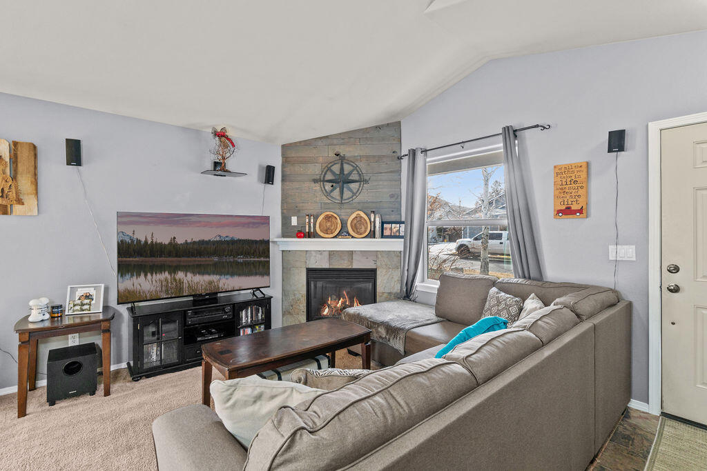 3144 Northeast Wells Acres Road Bend, OR 97701 - Photo 6 of 24 a living room with furniture and a fireplace