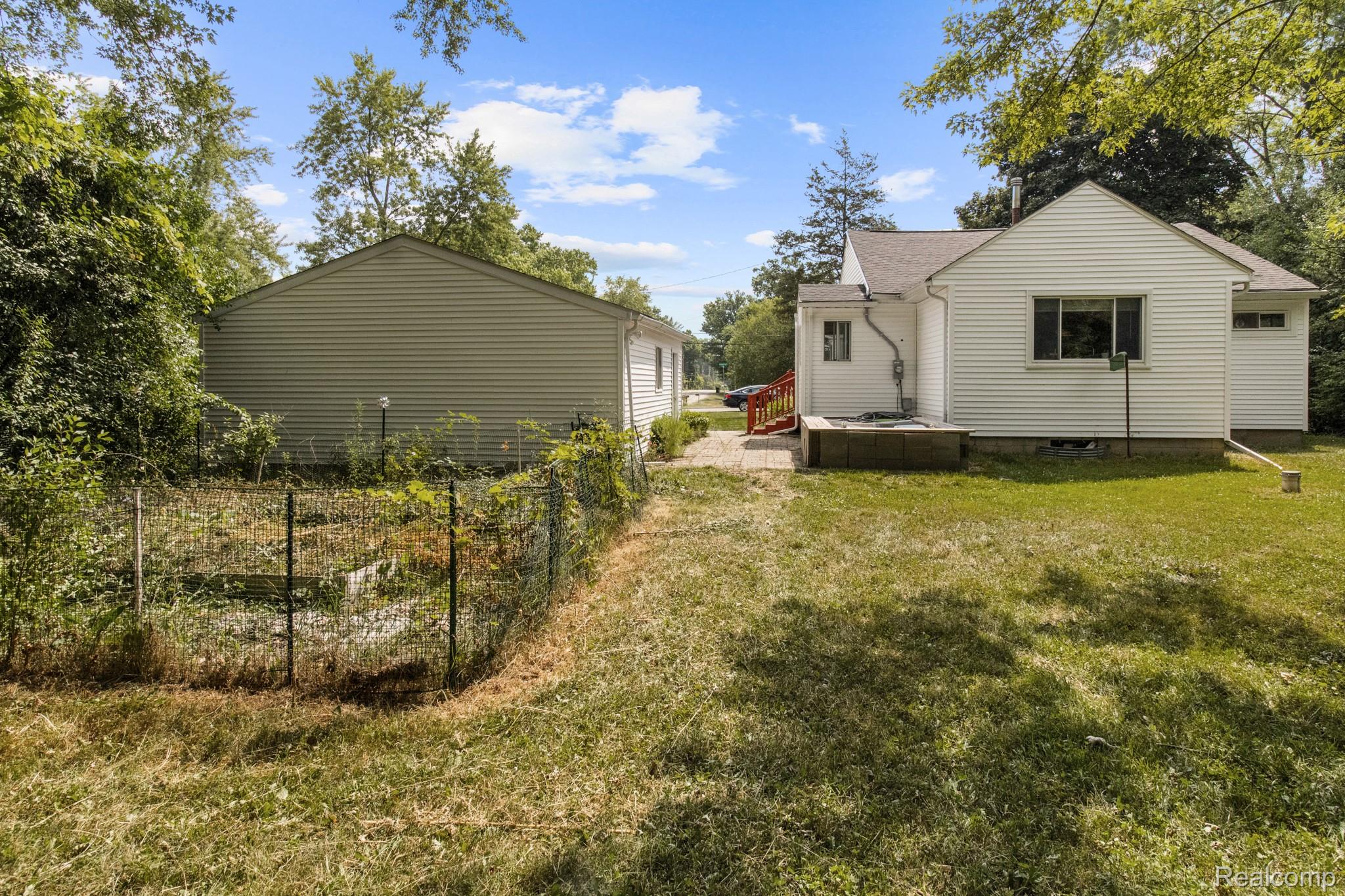 7330 Embury Road Grand Blanc, MI 48439 - Photo 28 of 29 Backyard and house.