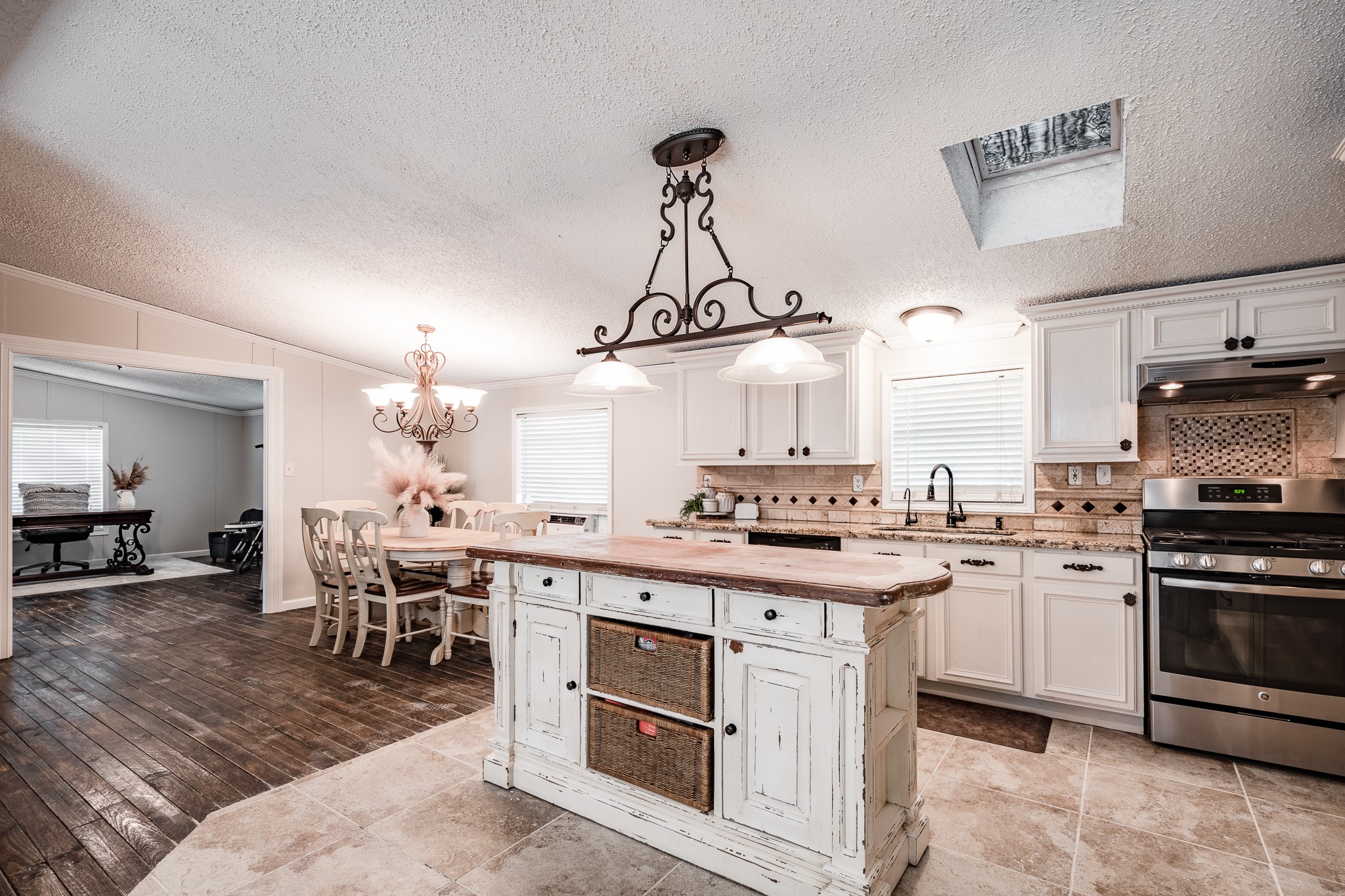 24274 Enloe Road Porter, TX 77365 - Photo 12 of 29 a kitchen with a sink stove and cabinets
