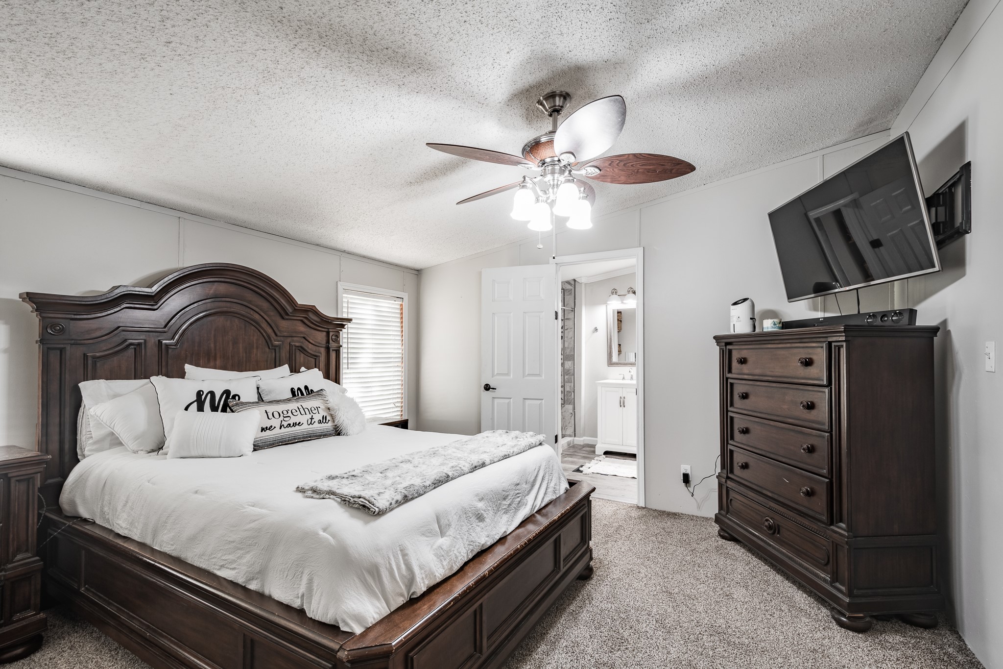 24274 Enloe Road Porter, TX 77365 - Photo 18 of 29 a bedroom with a bed and a flat screen tv