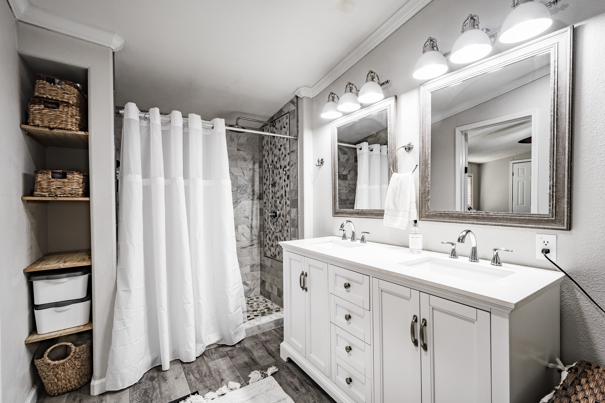 24274 Enloe Road Porter, TX 77365 - Photo 19 of 29 a bathroom with a double vanity sink mirror and double