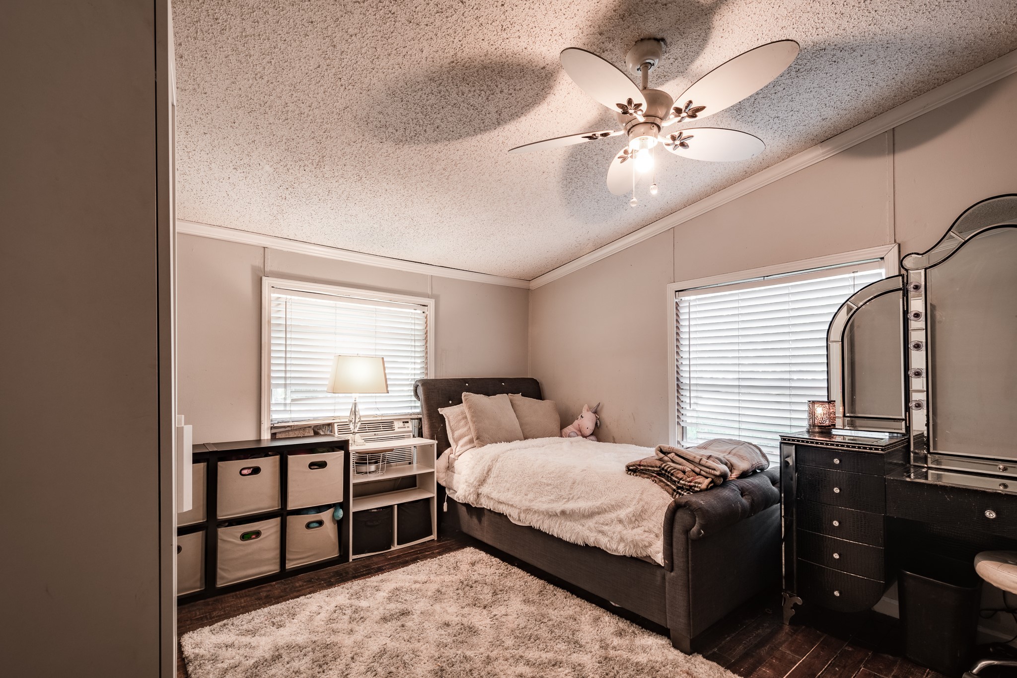 24274 Enloe Road Porter, TX 77365 - Photo 22 of 29 a bedroom with a bed and a ceiling fan