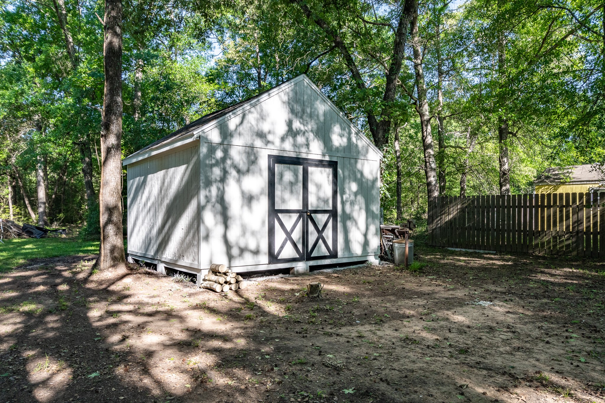 24274 Enloe Road Porter, TX 77365 - Photo 25 of 29 a view of backyard with small garden and deck