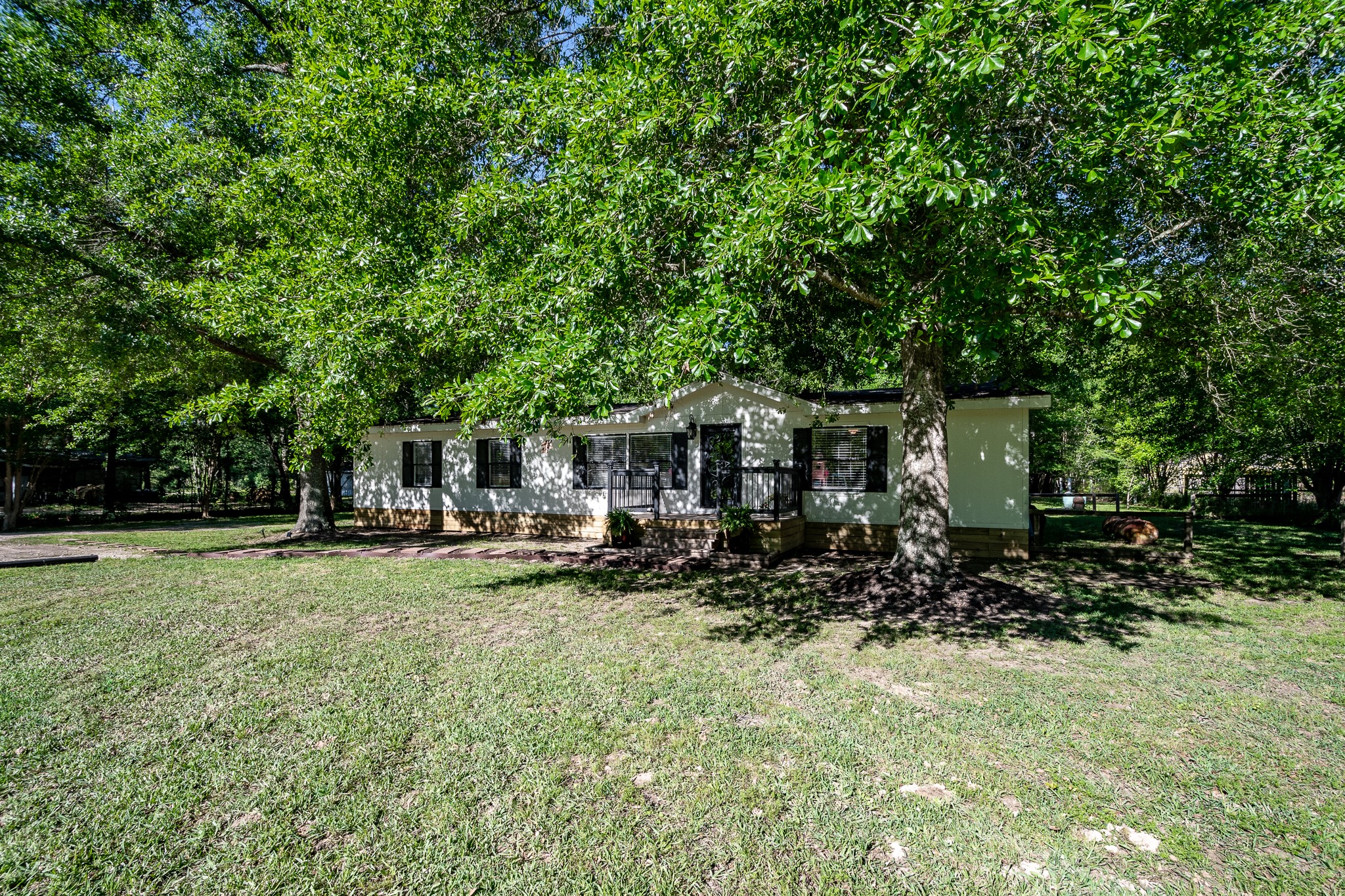 24274 Enloe Road Porter, TX 77365 - Photo 26 of 29 a view of a house with backyard sitting area and garden