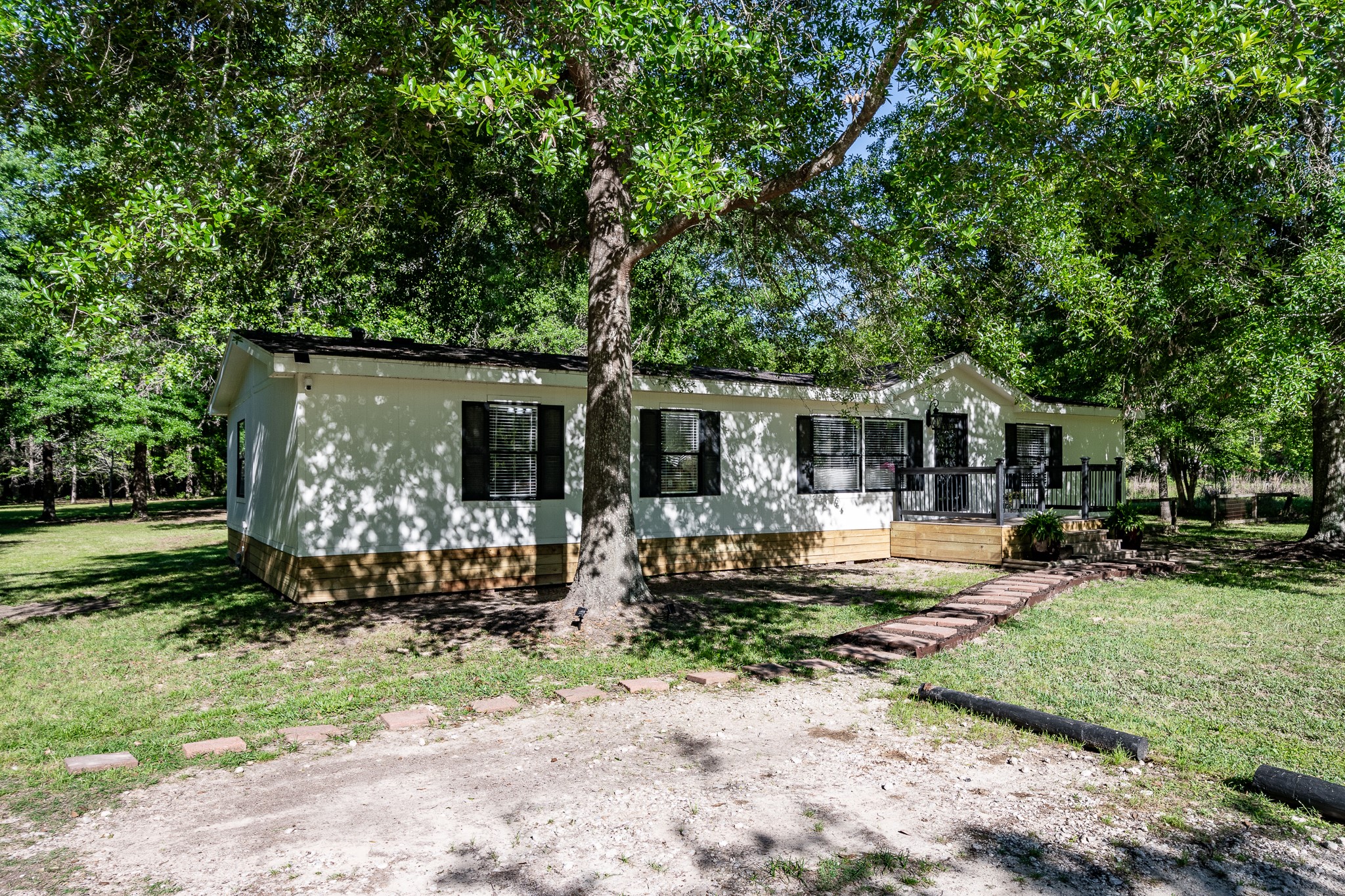 24274 Enloe Road Porter, TX 77365 - Photo 9 of 29 a front view of a house with garden