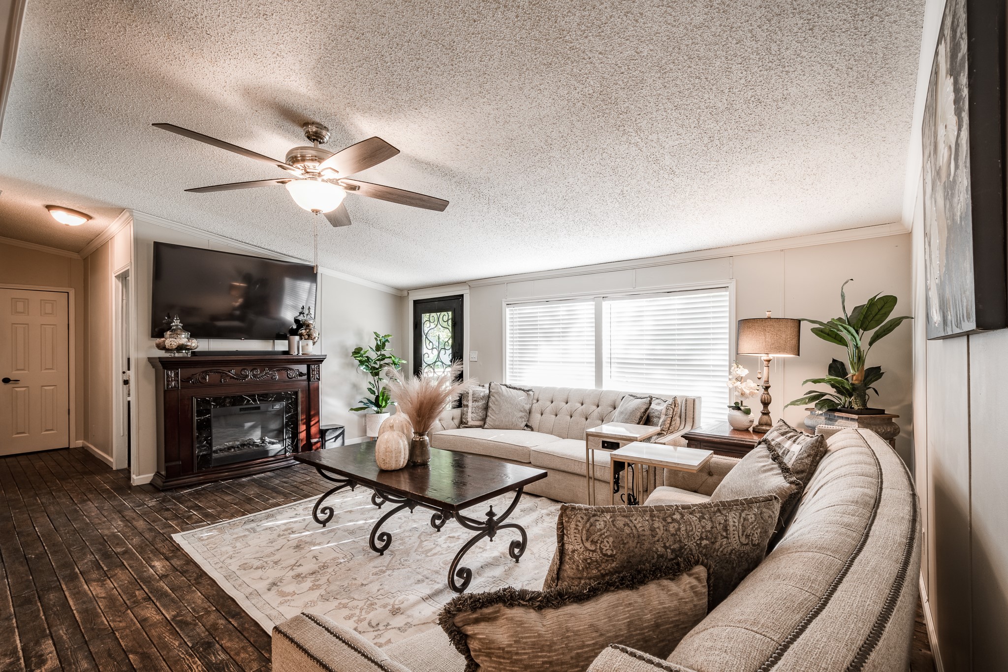 24274 Enloe Road Porter, TX 77365 - Photo 10 of 29 a living room with furniture and a fireplace
