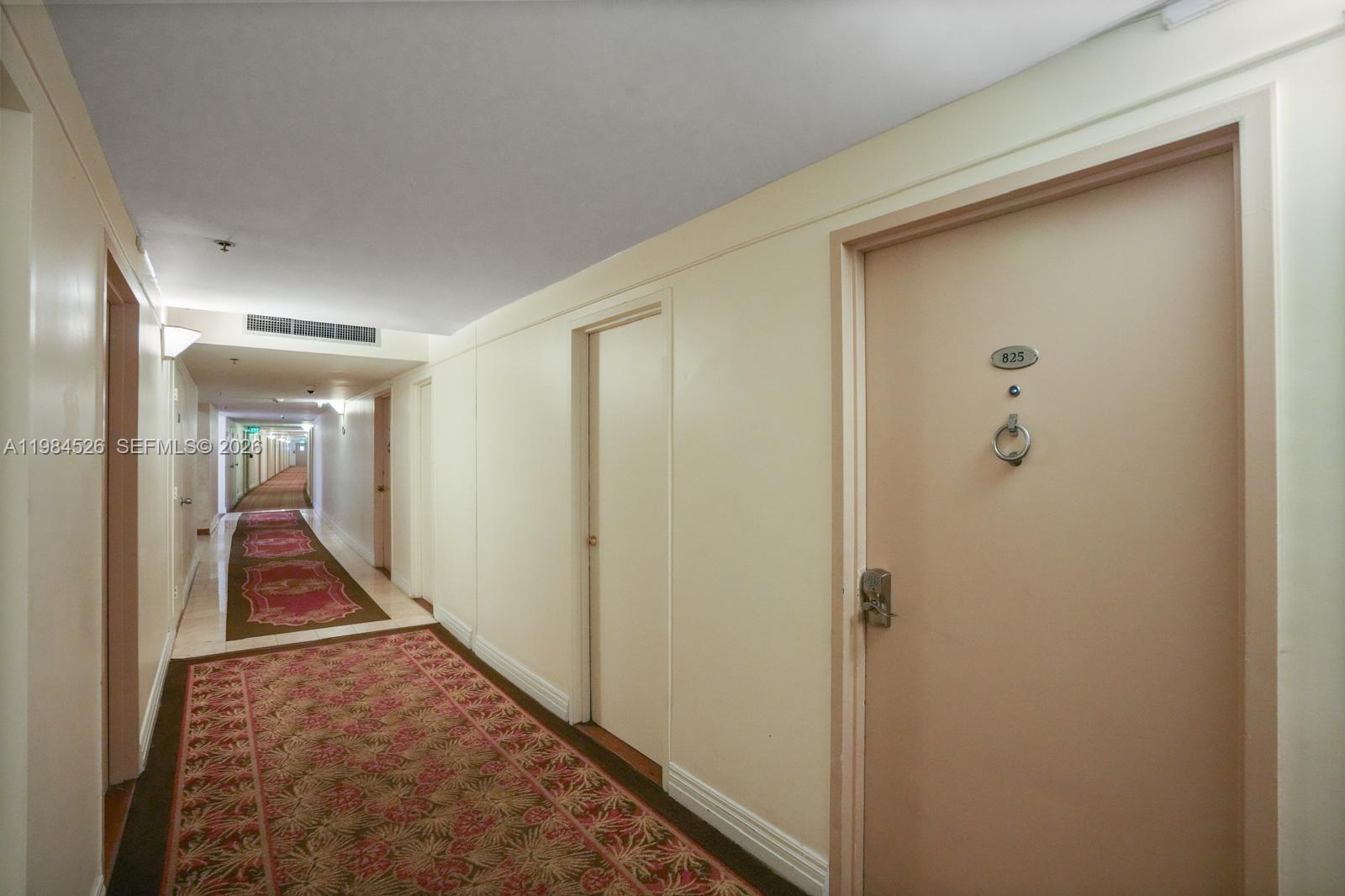 100 Lincoln Road, Unit 825 Miami Beach, FL 33139 - Photo 26 of 51 a view of a hallway with wooden floor and closet area