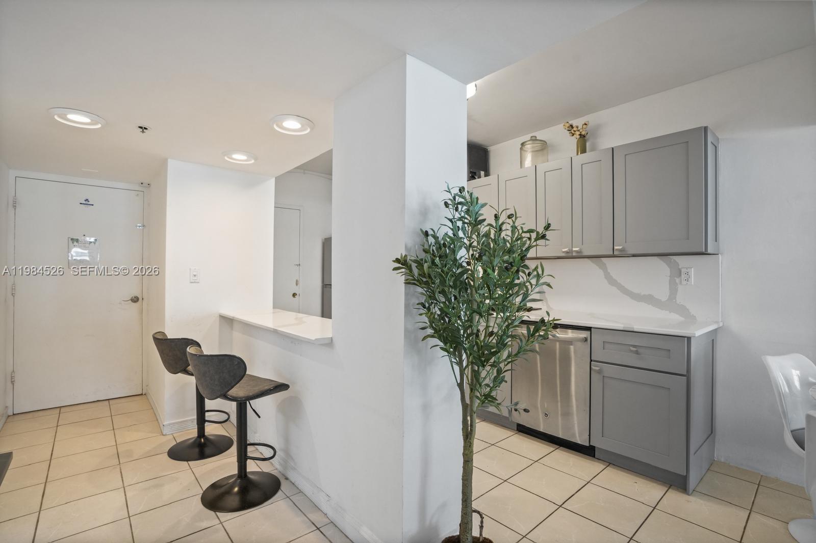 100 Lincoln Road, Unit 825 Miami Beach, FL 33139 - Photo 6 of 51 a living room with furniture and a potted plant