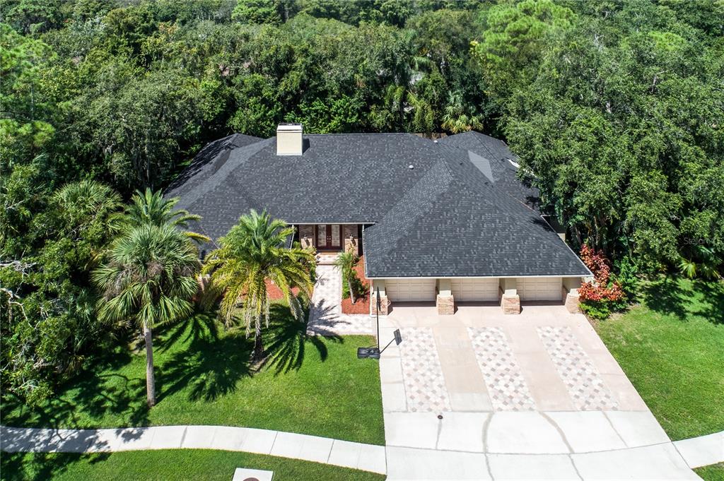 a terrace with outdoor seating and trees