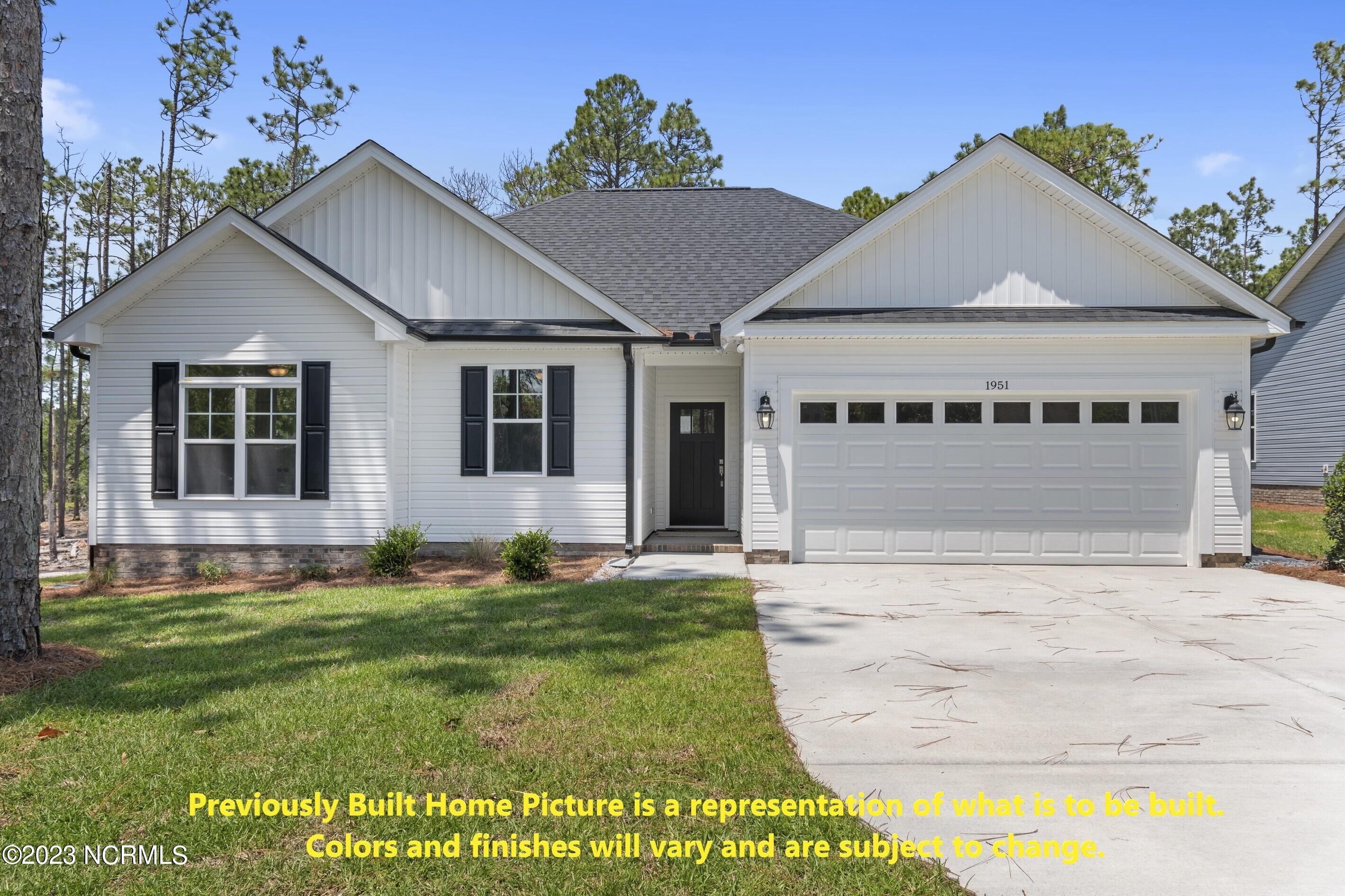 1028 Longleaf Road Southport, NC 28461 - Photo 1 of 49 Previously Built Home Picture is a representation of what is to be built. Colors and finishes will vary and are subject to change.