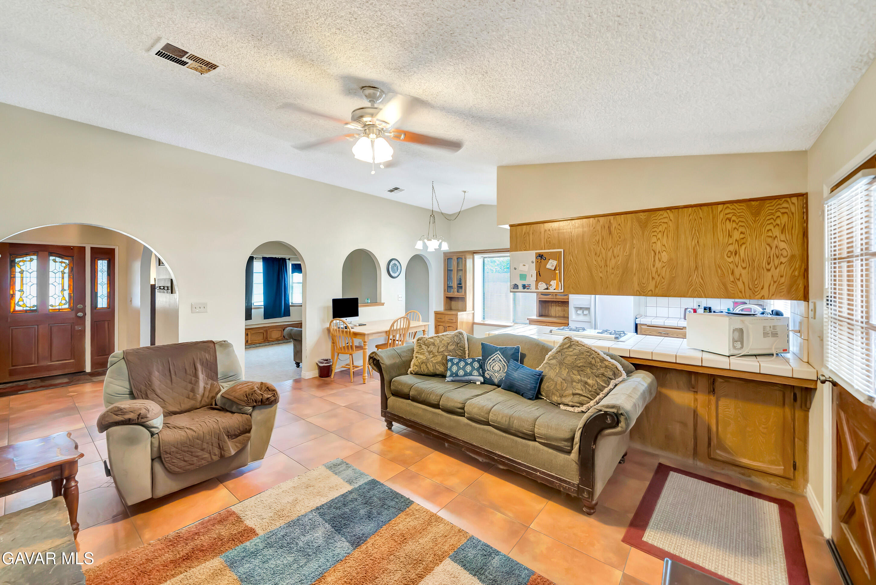 729 North Sunland Drive Ridgecrest, CA 93555 - Photo 12 of 52 a living room with furniture and a large window