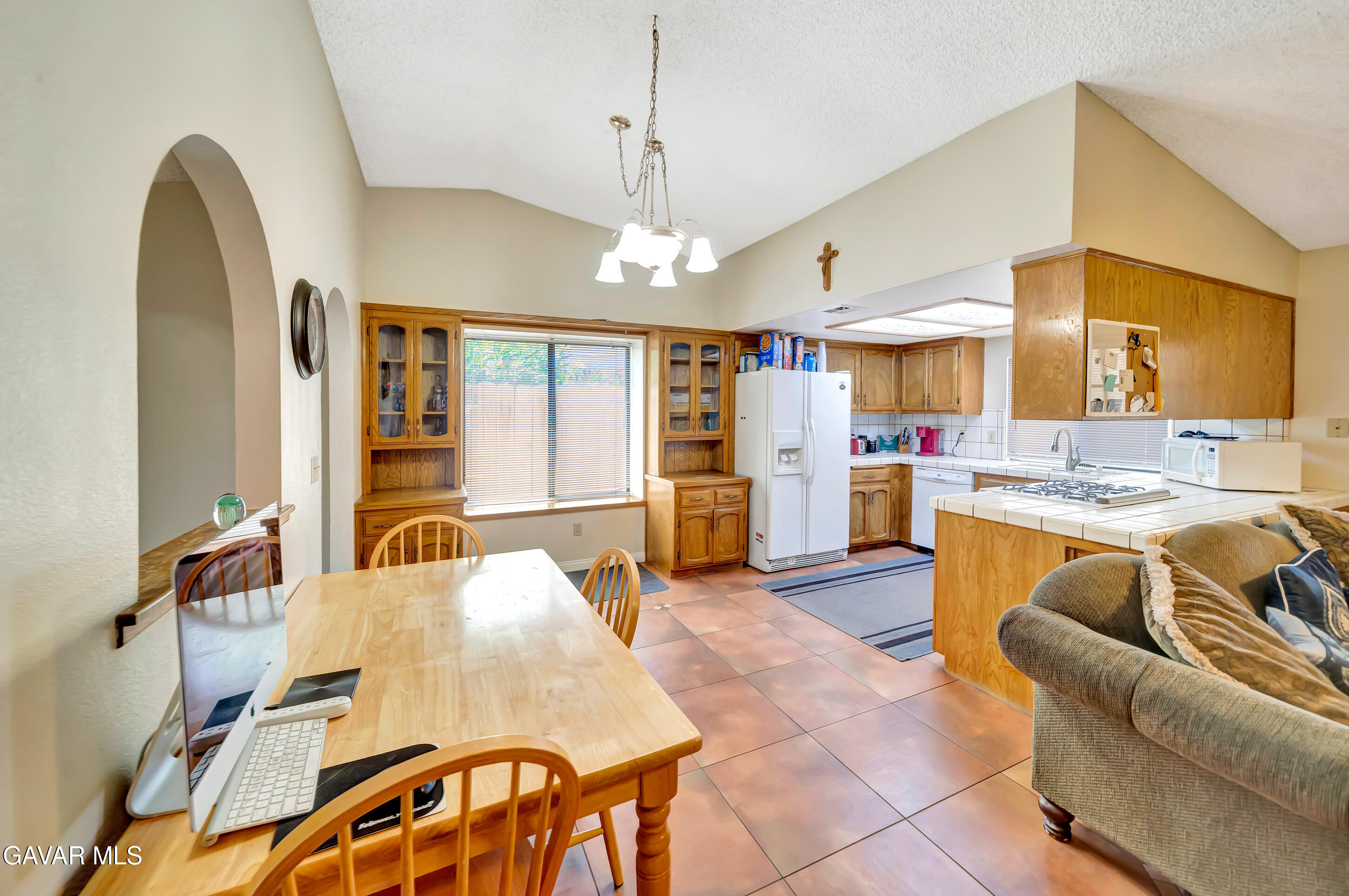 729 North Sunland Drive Ridgecrest, CA 93555 - Photo 15 of 52 a living room with kitchen island furniture and a chandelier