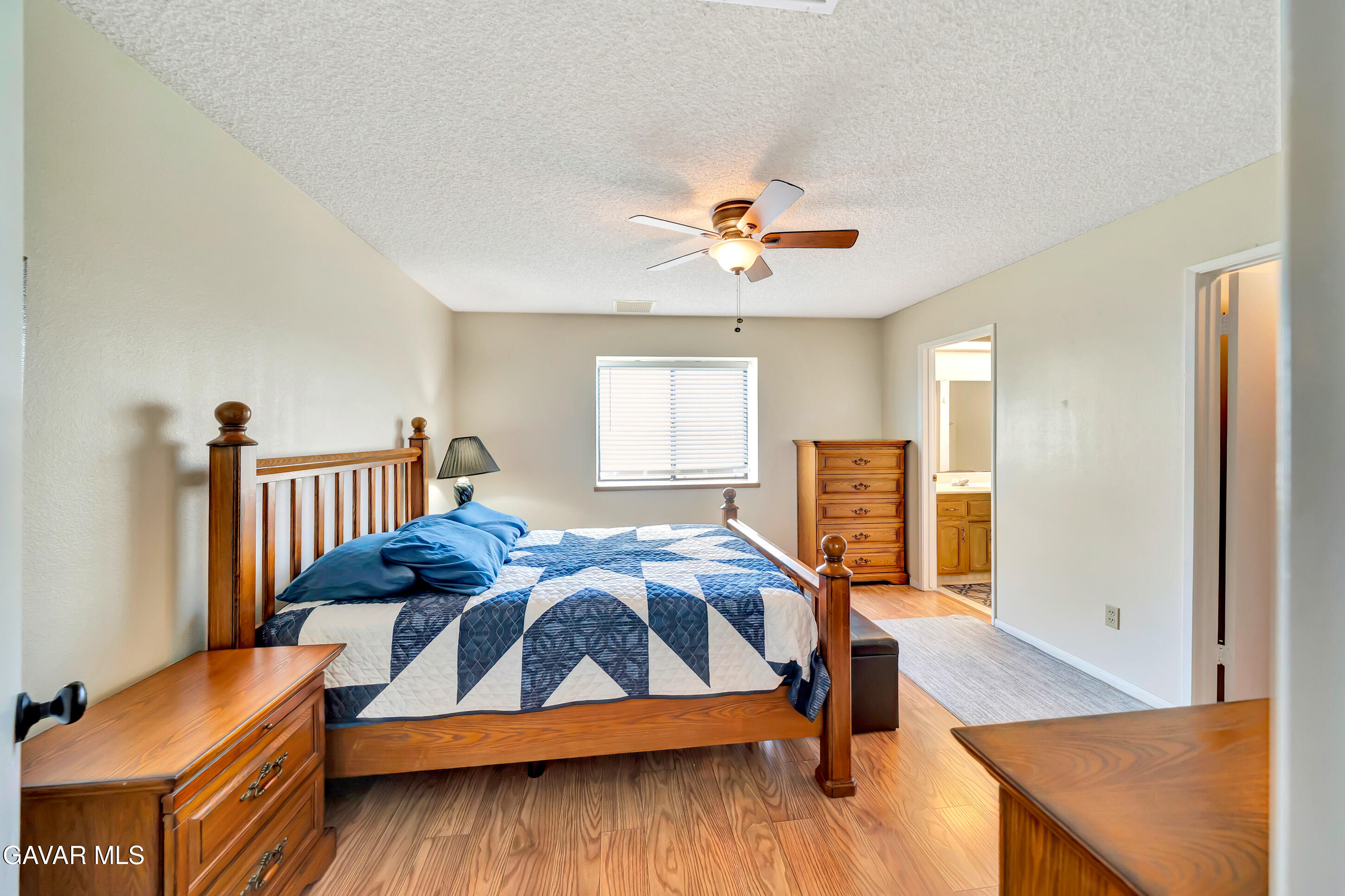 729 North Sunland Drive Ridgecrest, CA 93555 - Photo 23 of 52 a bedroom with furniture and window
