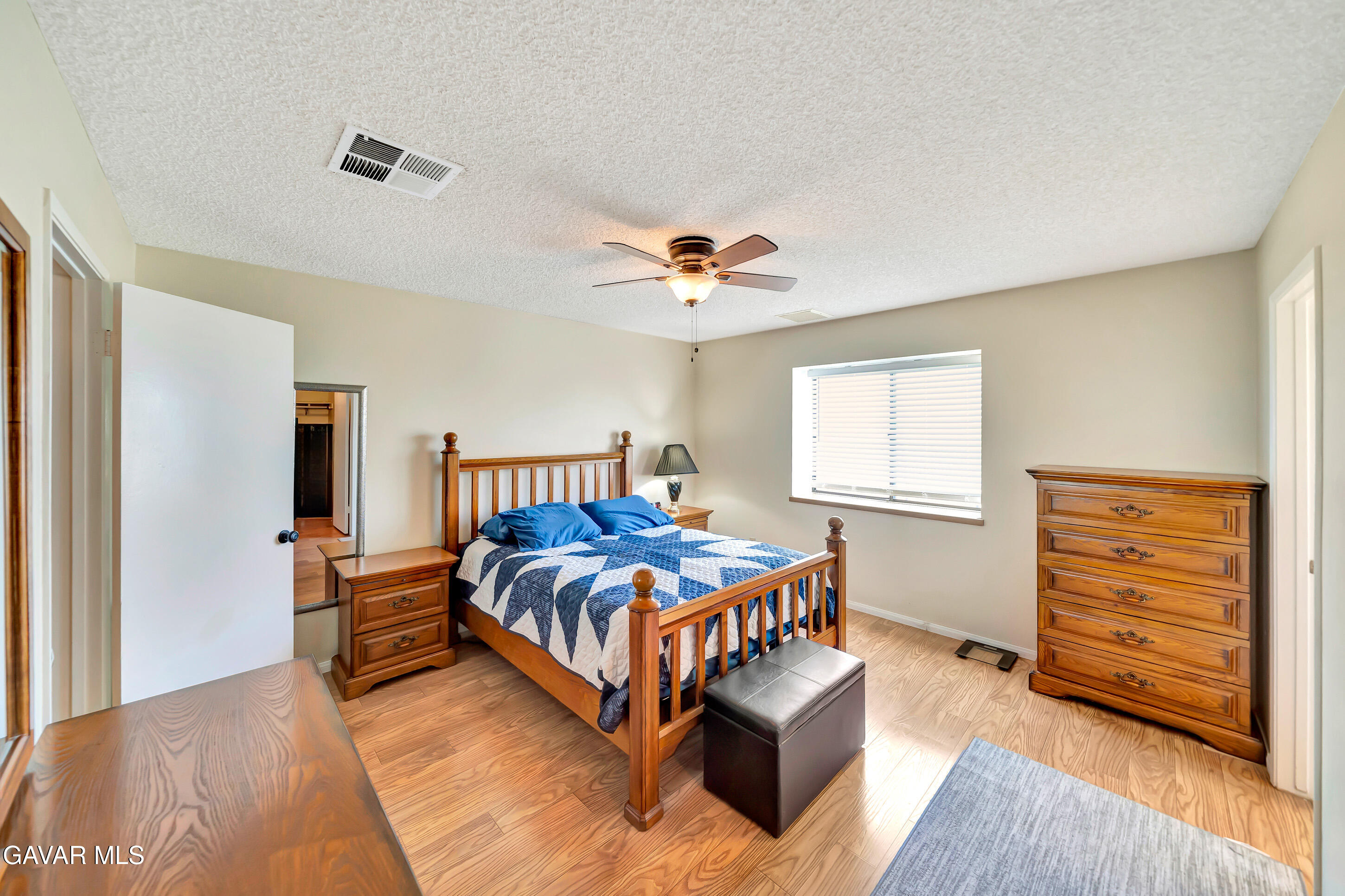 729 North Sunland Drive Ridgecrest, CA 93555 - Photo 24 of 52 a bedroom with a bed and a window