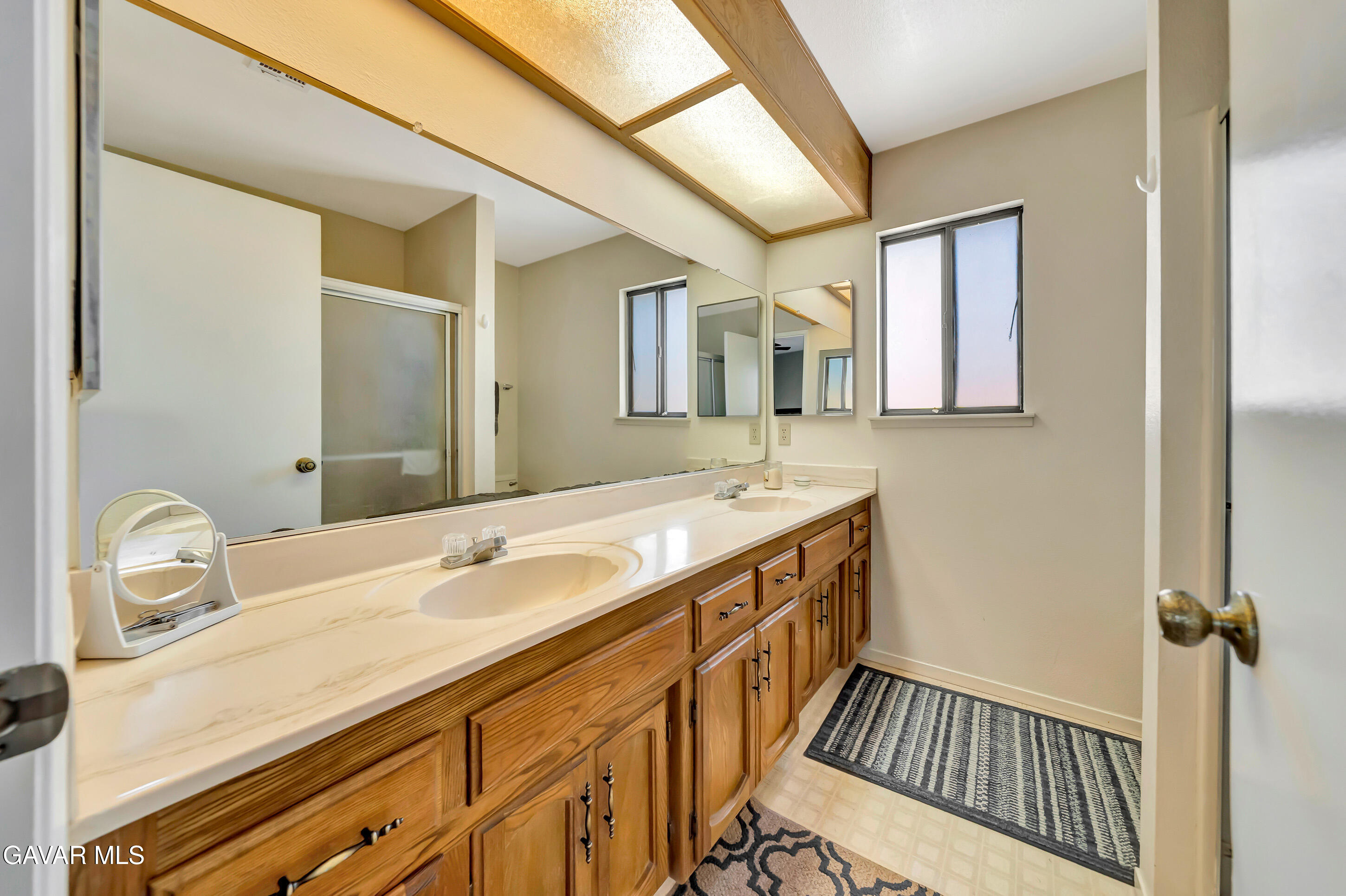 729 North Sunland Drive Ridgecrest, CA 93555 - Photo 26 of 52 a bathroom with a sink and a mirror