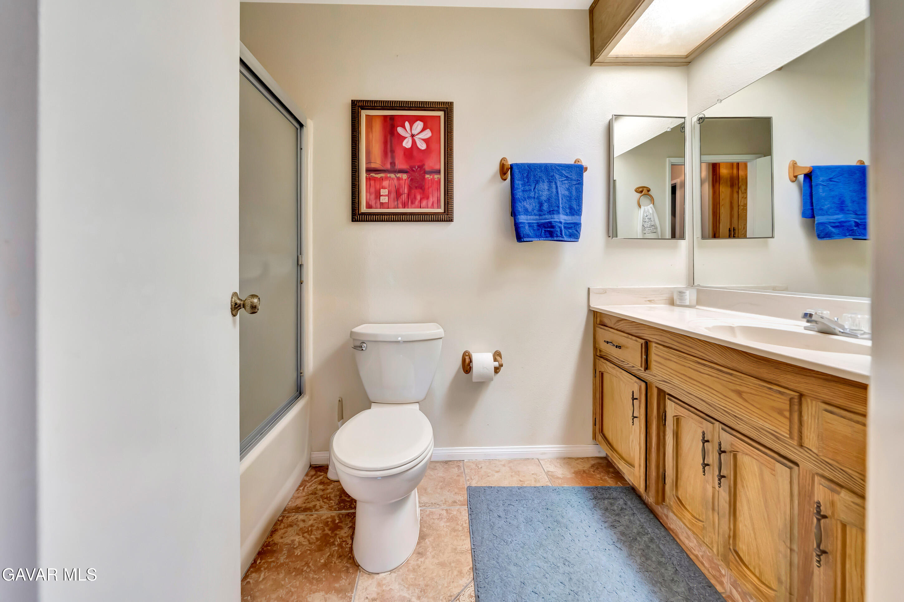 729 North Sunland Drive Ridgecrest, CA 93555 - Photo 31 of 52 a bathroom with a sink a toilet and mirror