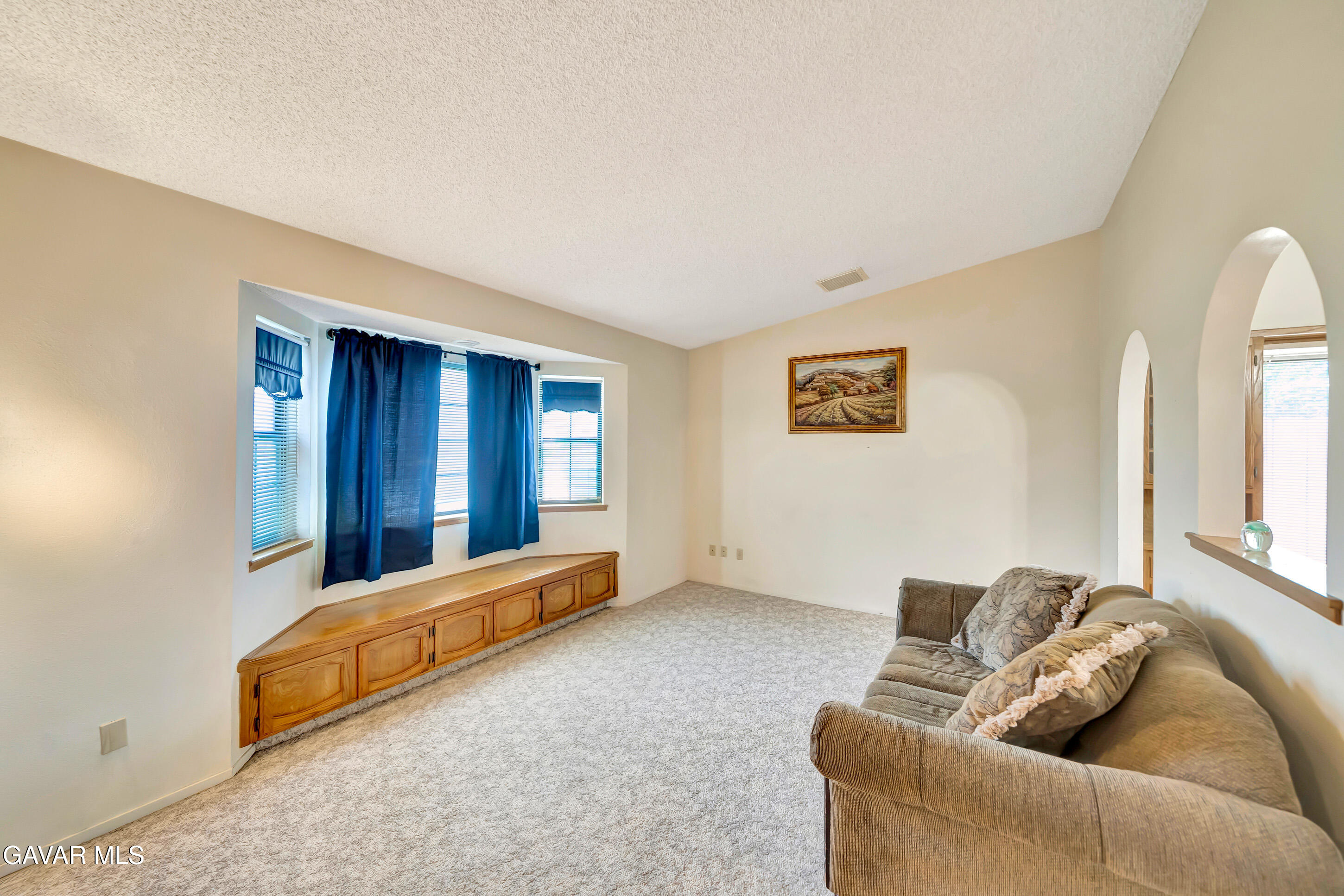 729 North Sunland Drive Ridgecrest, CA 93555 - Photo 8 of 52 a living room with furniture and a window