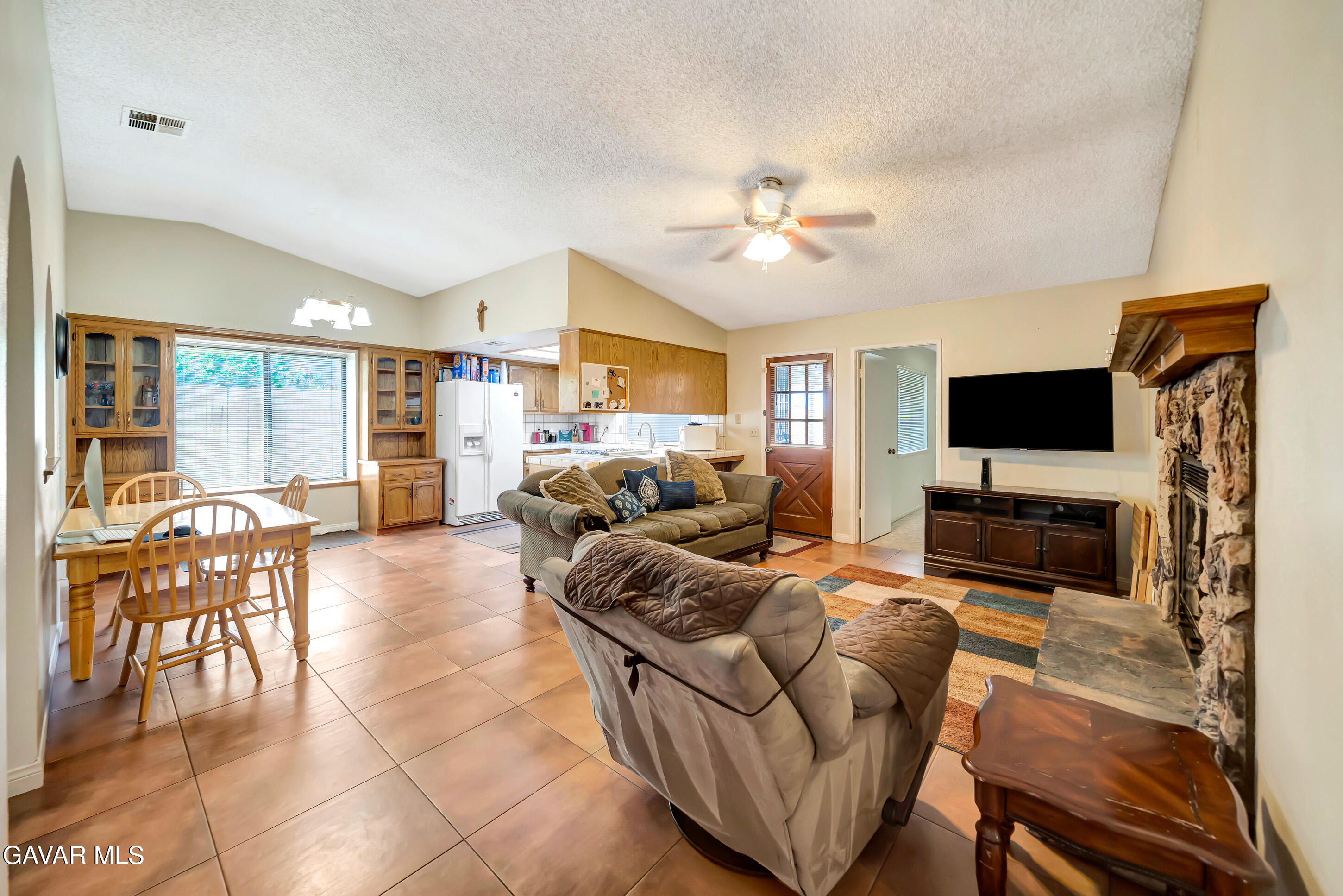729 North Sunland Drive Ridgecrest, CA 93555 - Photo 10 of 52 a living room with furniture and a flat screen tv
