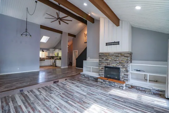 a bedroom with bed and painting on the wall