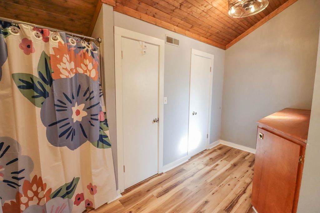 205 Charles Martin Road Ripley, TN 38063 - Photo 31 of 34 a bedroom with a bed and a painting on the wall