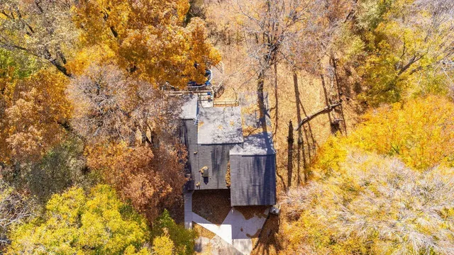 a dining room with furniture entryway and wooden floor