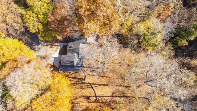 a kitchen with a sink stainless steel appliances cabinets and a counter top space
