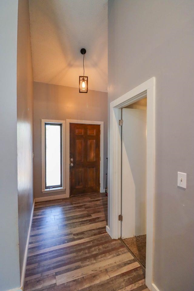 205 Charles Martin Road Ripley, TN 38063 - Photo 9 of 34 a view of a hallway with wooden floor and closet