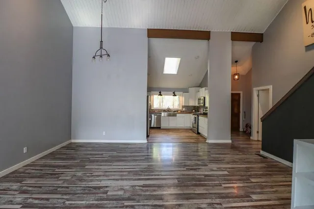 wooden floor in an empty room with a fireplace