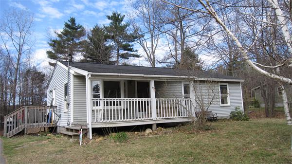 46 Breakneck Road Sturbridge, MA 01566 - Photo 1 of 15 a view of a house with a yard and deck