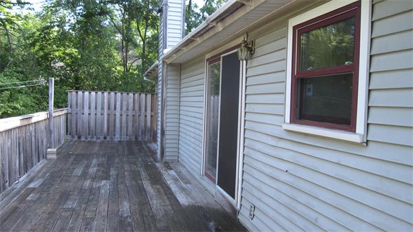 46 Breakneck Road Sturbridge, MA 01566 - Photo 3 of 15 a view of a house with wooden floor and wooden fence