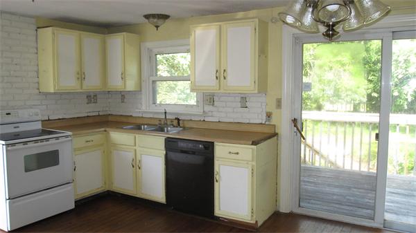 46 Breakneck Road Sturbridge, MA 01566 - Photo 5 of 15 a kitchen with a sink and a window