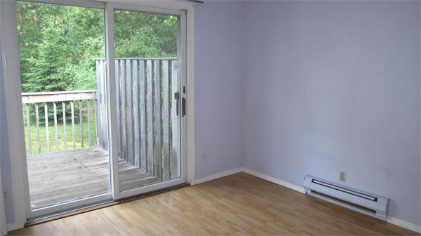 46 Breakneck Road Sturbridge, MA 01566 - Photo 6 of 15 a view of a small space with wooden floor and a window