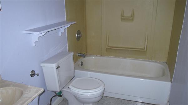 46 Breakneck Road Sturbridge, MA 01566 - Photo 8 of 15 a bath room with a toilet and a bath tub