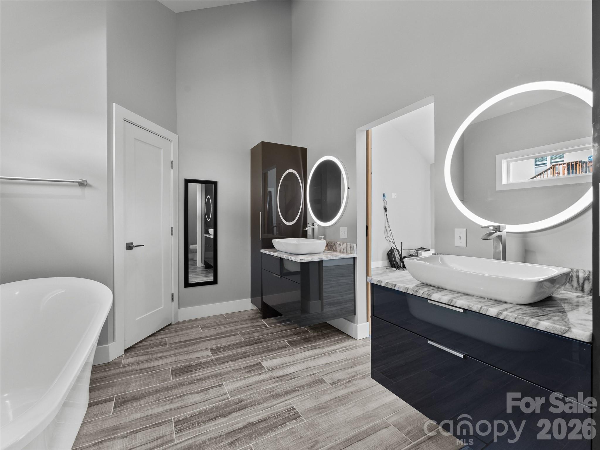 123 Israel Road Candler, NC 28715 - Photo 23 of 44 a bathroom with a granite countertop sink and a mirror