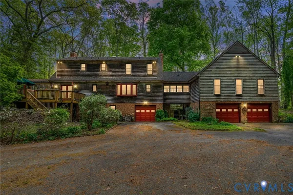 a front view of a house with trees
