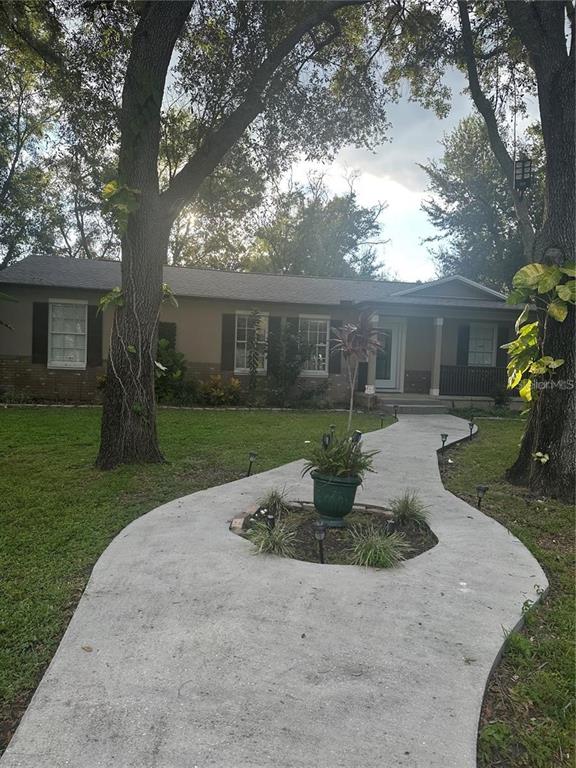 10520 Henderson Road Tampa, FL 33625 - Photo 3 of 9 front view of house with a yard