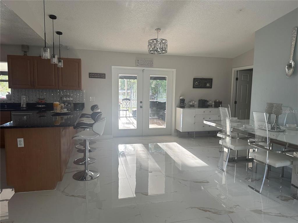 10520 Henderson Road Tampa, FL 33625 - Photo 7 of 9 a kitchen with a sink and a stove top oven