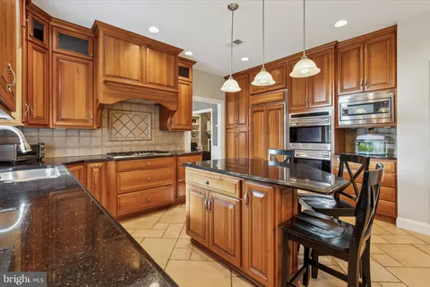 a living room with furniture or couch and a potted plant