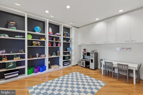 a spacious bedroom with a bed and a ceiling fan