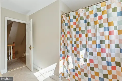 a bedroom with bed and window